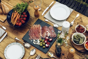 Silver Spoon and Forks Beside Vegetables
