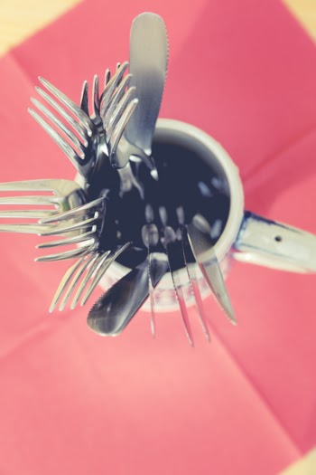 Silver Steel Utensils Inside White Ceramic Mug