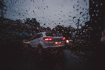 Silver Suv on Asphalt Road during Rain