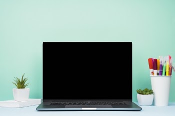 Simplistic front view laptop on desk Free Photo