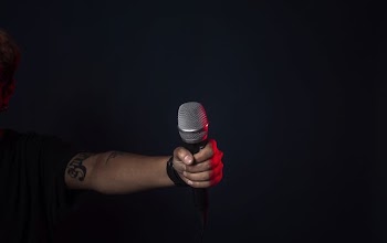 Singer On Stage Holds Mic