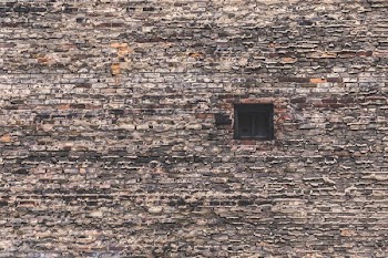 Single Window In Large Brick Wall