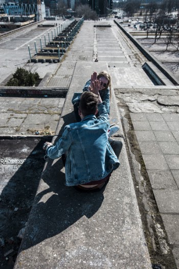 Sitting Man Wearing Blue Chambray Jacket