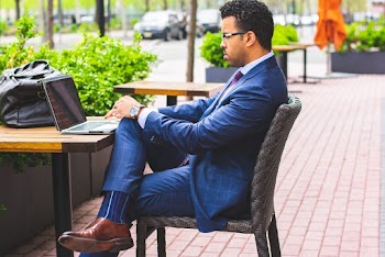 Sitting Man Wearing Formal Suit Using Laptop Computer