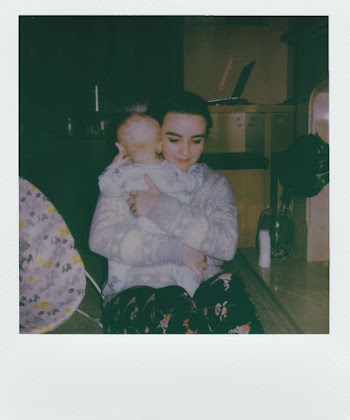 Sitting Woman Holding Baby Screenshot