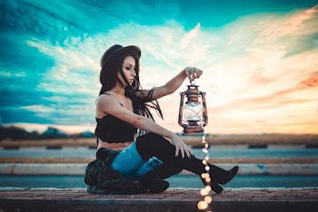 Sitting Woman Holding Lantern