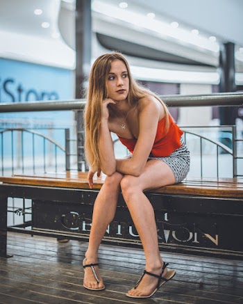 Sitting Woman in Orange Tube Blouse