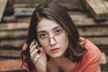 Sitting Woman Wearing Eyeglasses
