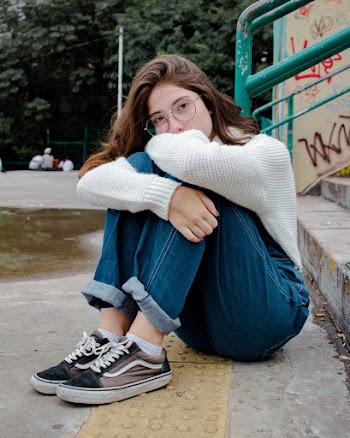 Sitting Woman Wearing Gray Knit Jacket