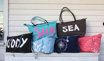 Six Assorted Colors Tote Bags on White Wooden Cabinet