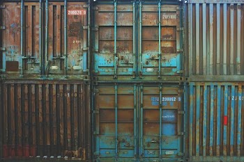 six blue freight containers