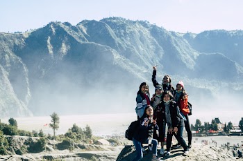 Six Girls Standing on Mountain Cliff