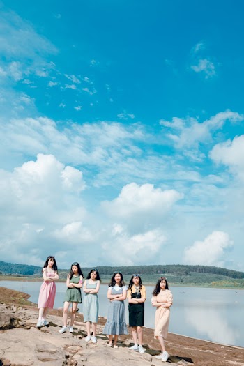 Six Women Near Body of Water