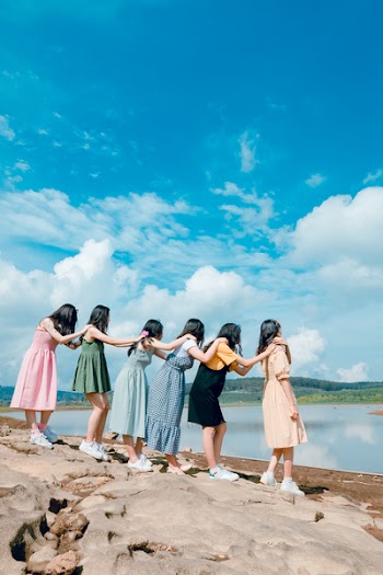 Six Women Standing By The Lake