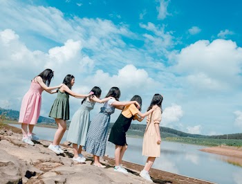 Six Women Standing Near Body Of Water