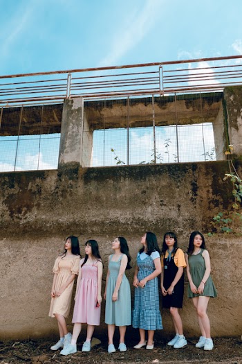 Six Women Stands in Front of Gray Concrete Wall