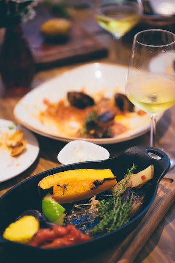 Sizzling Plate Filled by Sliced Fruit and Herb