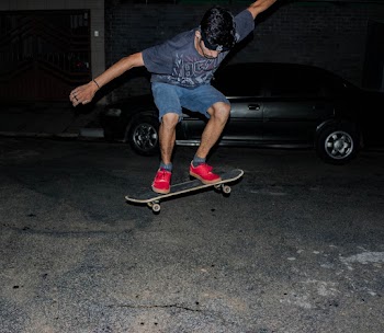 Skateboarder Doing Tricks