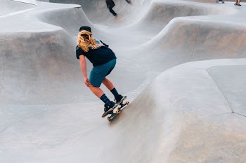 Skateboarder In Skate Park