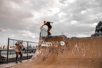 Skater on Edge of Skate Ramp