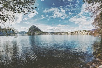Skyline Photography of Mountain and Buildings at Daytime