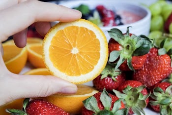 Slice Orange Fruit and Strawberries