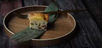 Sliced Baked Cake on Round Brown Plate