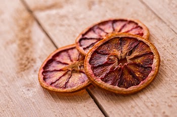 Sliced Fruit on Brown Wooden Surface
