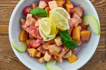Sliced Fruits In White Bowl