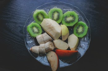 Sliced Fruits on Glass Plate