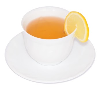 Sliced Lemon on White Ceramic Cup With Tea