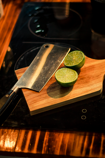 Sliced Lemons on Brown Wooden Chopping Board