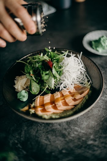 Sliced Meat With Vegetable on Black Ceramic Plate