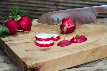 Sliced Radish on Brown Wooden Chopping Board