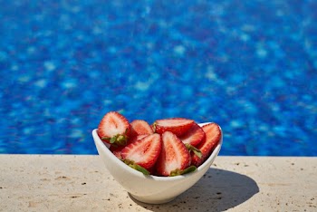 Sliced Strawberries on White Bowl