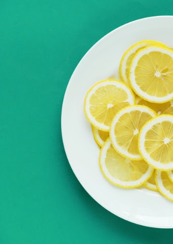 Slices of Lemon on White Plate