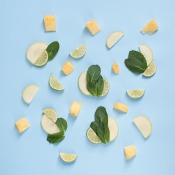 Slices of tropical fruit on a blue background