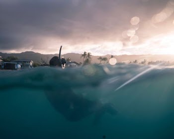 slit shot photography of man diving