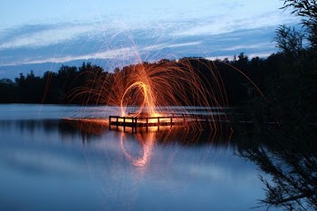 slow shutter photo of fire dance