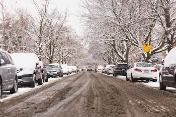 Slushy Winter Street With Parked Cars