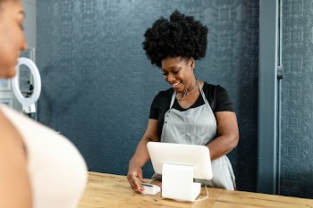 small business owner at a cash register  | Free stock photo | High Resolution image