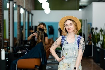 Small business owner posing in front of her… | Free stock photo | High Resolution image
