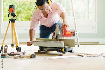 smart indian contractor hand use sawing machine wood work house renovation background home improvement ideas concept