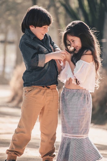 Smiling Boy and Girl Having Fun