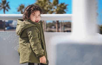 Smiling Boy Wearing Brown Hooded Jacket
