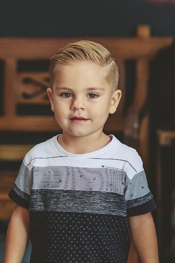 Smiling Boy Wearing White And Black Crew Neck T-shirt