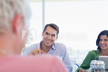 Smiling business people in meeting