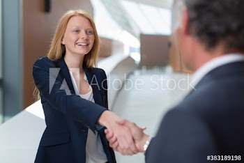Smiling business people shaking hands
