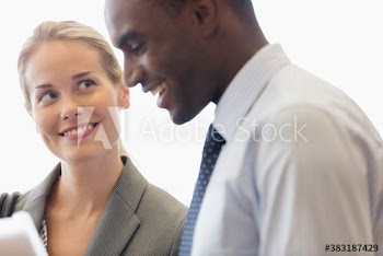 Smiling business people talking in meeting