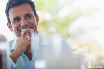 Smiling businessman looking away